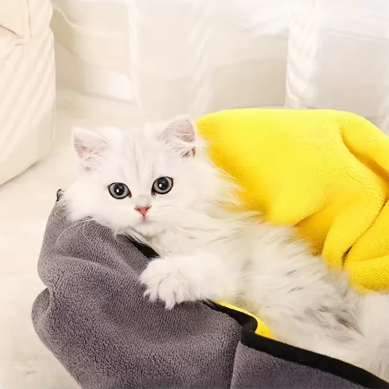 Cat wrapped in a soft yellow and grey microfiber pet towel