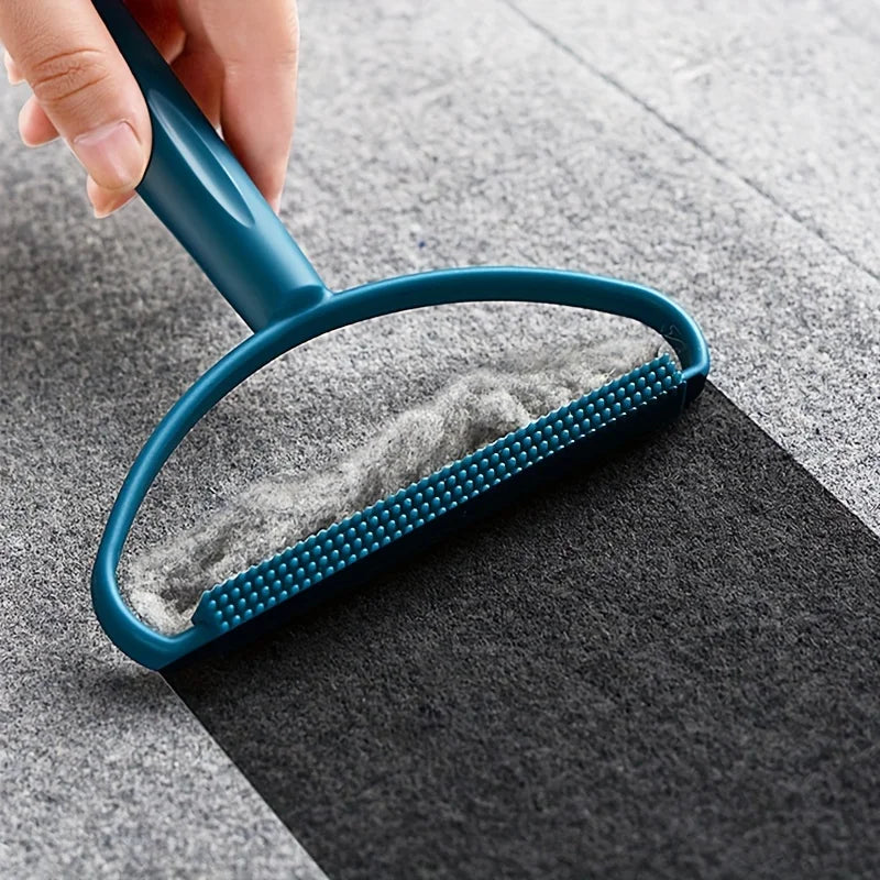 FurReset gathering hair from a sturdy grey fabric